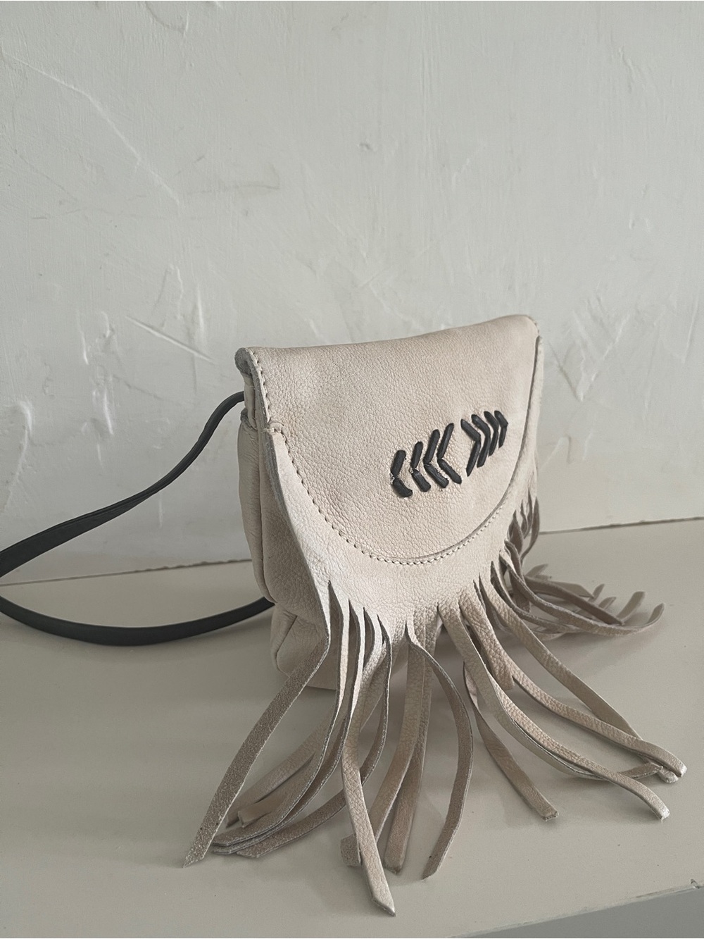 Cut N Paste Light Beige Fringe Crossbody Bag with Black Accent. NWOT.